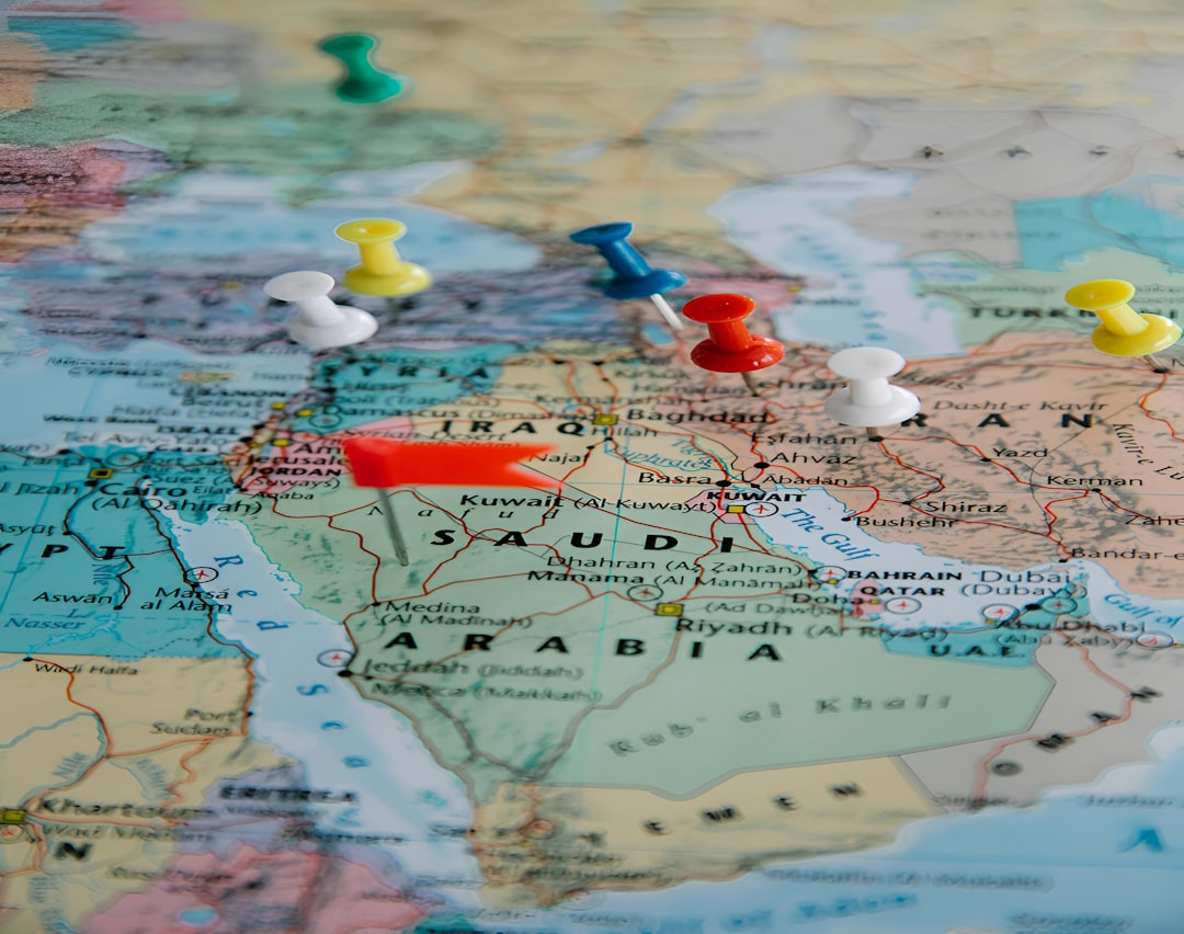 colorful-pushpins-marking-locations-on-a-world-map-ilhclr4ckc